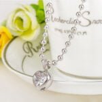 Elegant Platinum-Plated Heart Pendant Necklace and Earrings Set with Cubic Zirconia